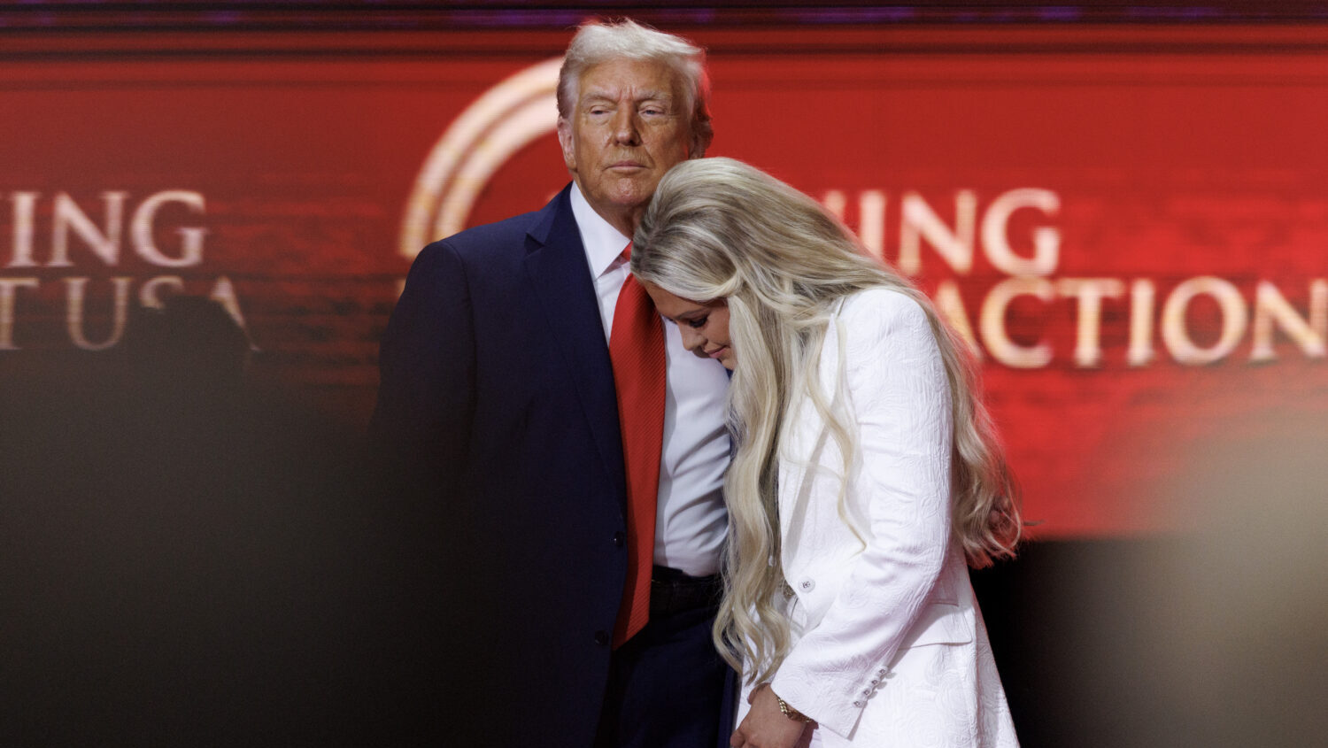 GLENDALE, ARIZONA - SEPTEMBER 21: Erika Kirk joins U.S. President Donald Trump onstage during the m...