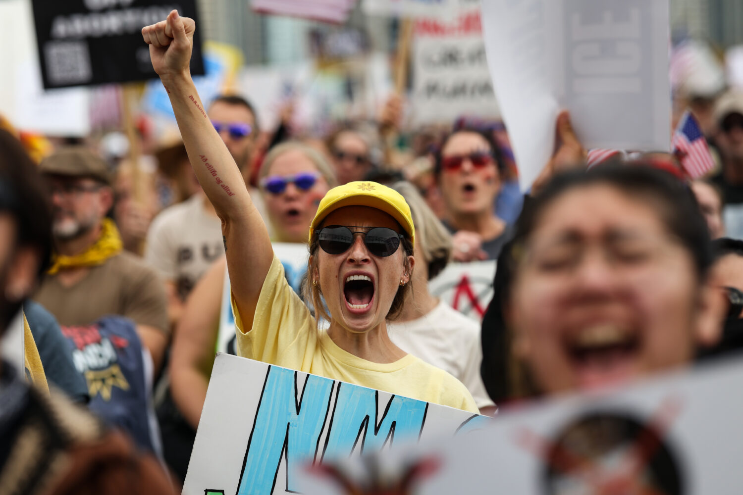 CHICAGO, ILLINOIS - OCTOBER 18: Protestors march in the second "No Kings" protest on October 18, 20...