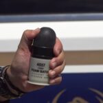 A 40mm 'less lethal' round is displayed by Phoenix Police, describing the tools used to try to detain Dylan Rockford Fohrenkam (Photo courtesy Phoenix Police Department).