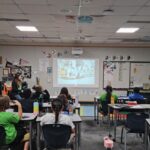 Third graders at Kyrene de la Colina track their reading minutes for the Read to the Final Four contest. (Shira Tanzer/KTAR News)