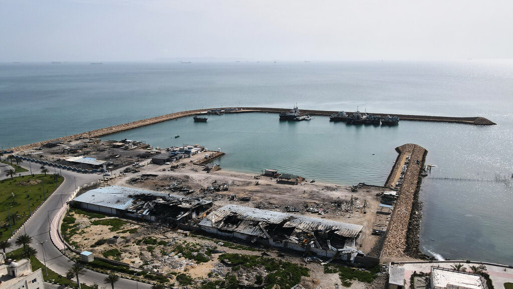 Backdropped by ships in the Strait of Hormuz, damage, according to local witnesses caused by severa...