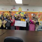 Teachers at David Crockett Elementary School are surprised with $2,500. (Shira Tanzer/KTAR News)