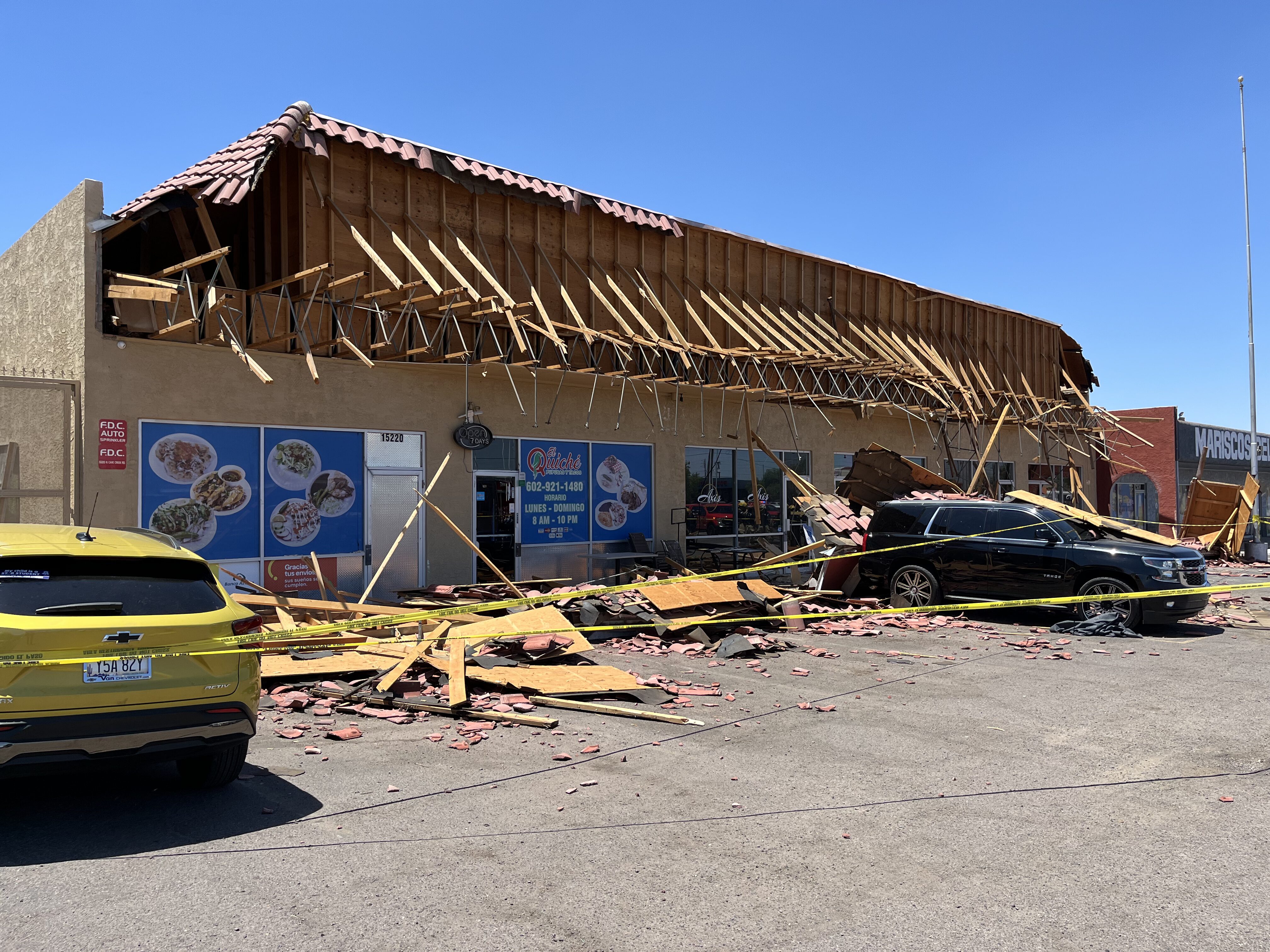 Phoenix fire crews respond after part of a shopping center roof collapsed near Cave Creek and Green...