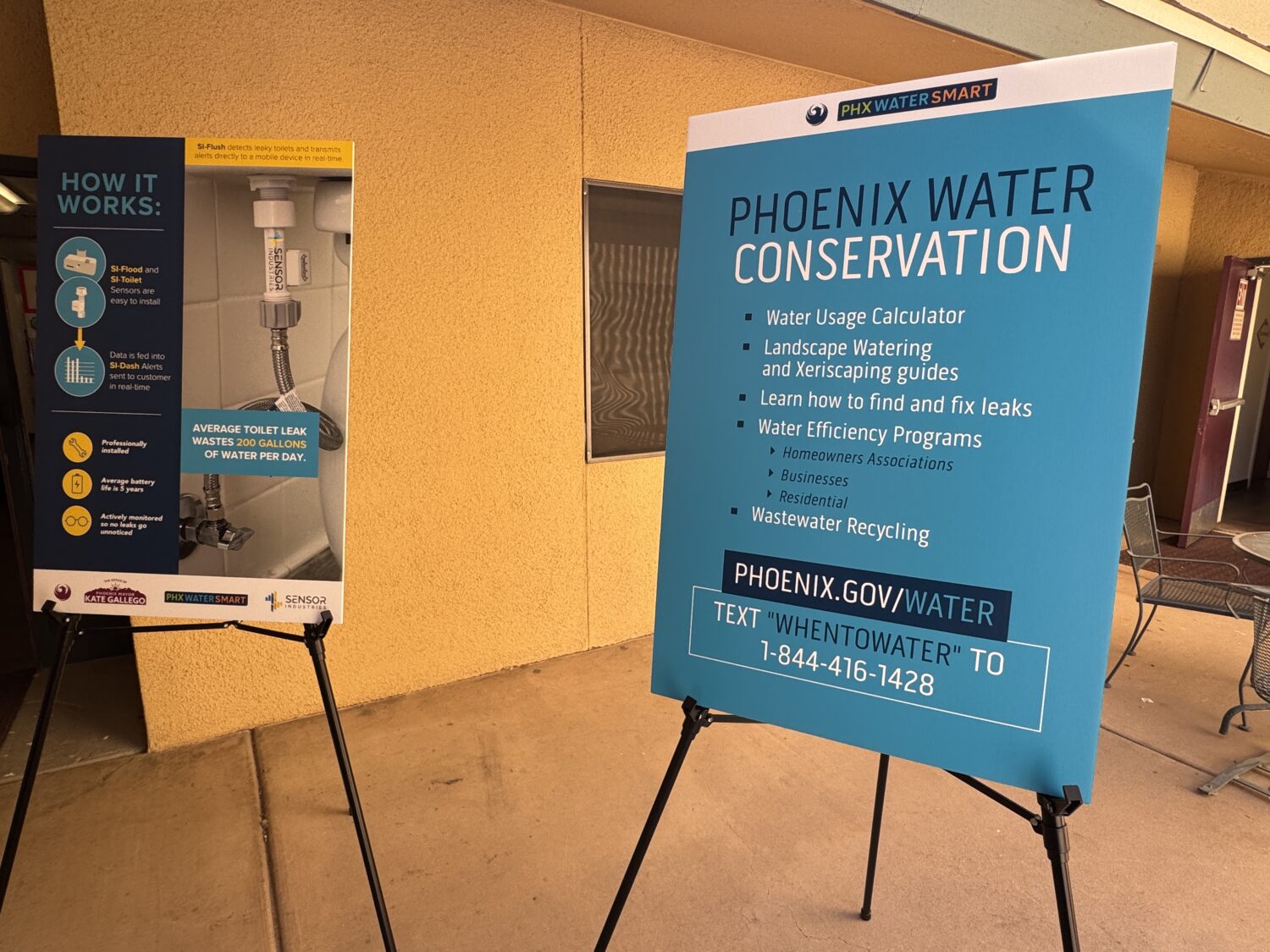 Signs displayed at Fillmore Gardens on Friday outline Phoenix's water conservation resources and ex...