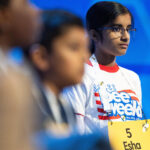 Arizona's Esha Marupudi waits to take her turn during the quarterfinals of the Scripps National Spelling Bee, Wednesday, May 27, 2026, in Washington. (AP Photo/Allison Robbert)