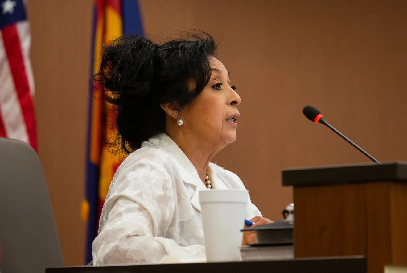 Arizona state Rep. Lydia Hernandez speaks into a microphone during a legislative or board meeting. ...