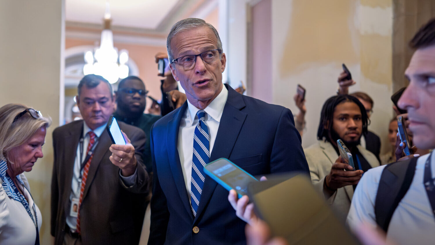 Senate Majority Leader John Thune, R-S.D., pauses for questions from reporters before votes on the ...