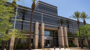 Construction firm leases large building in Phoenix's Camelback Corridor, plans to make it regional HQ