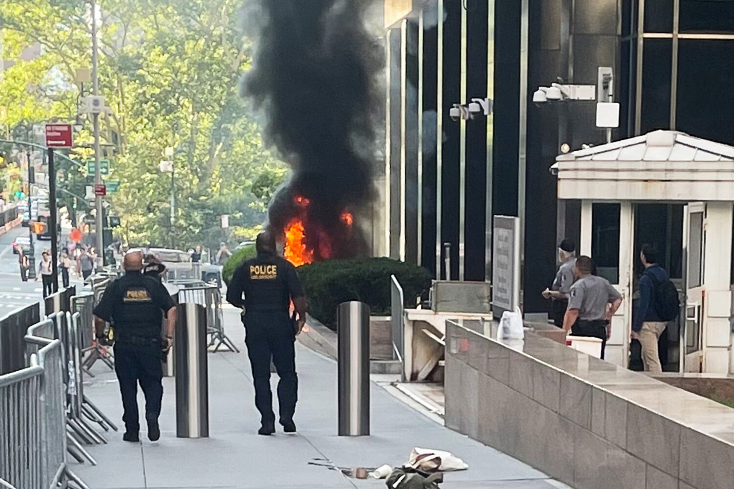 This photo provided by Robert Sullivan shows black smoke and flames in front of 26 Federal Plaza in...