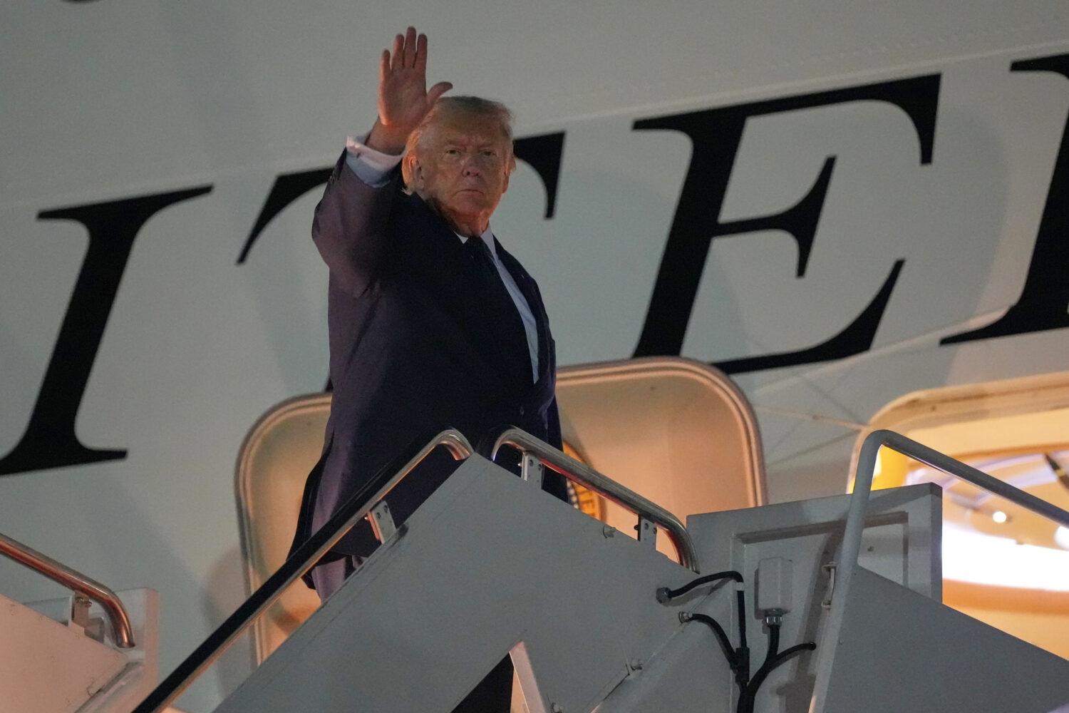 President Donald Trump waves as he boards Air Force One, Monday, July 6, 2026, at Joint Base Andrew...