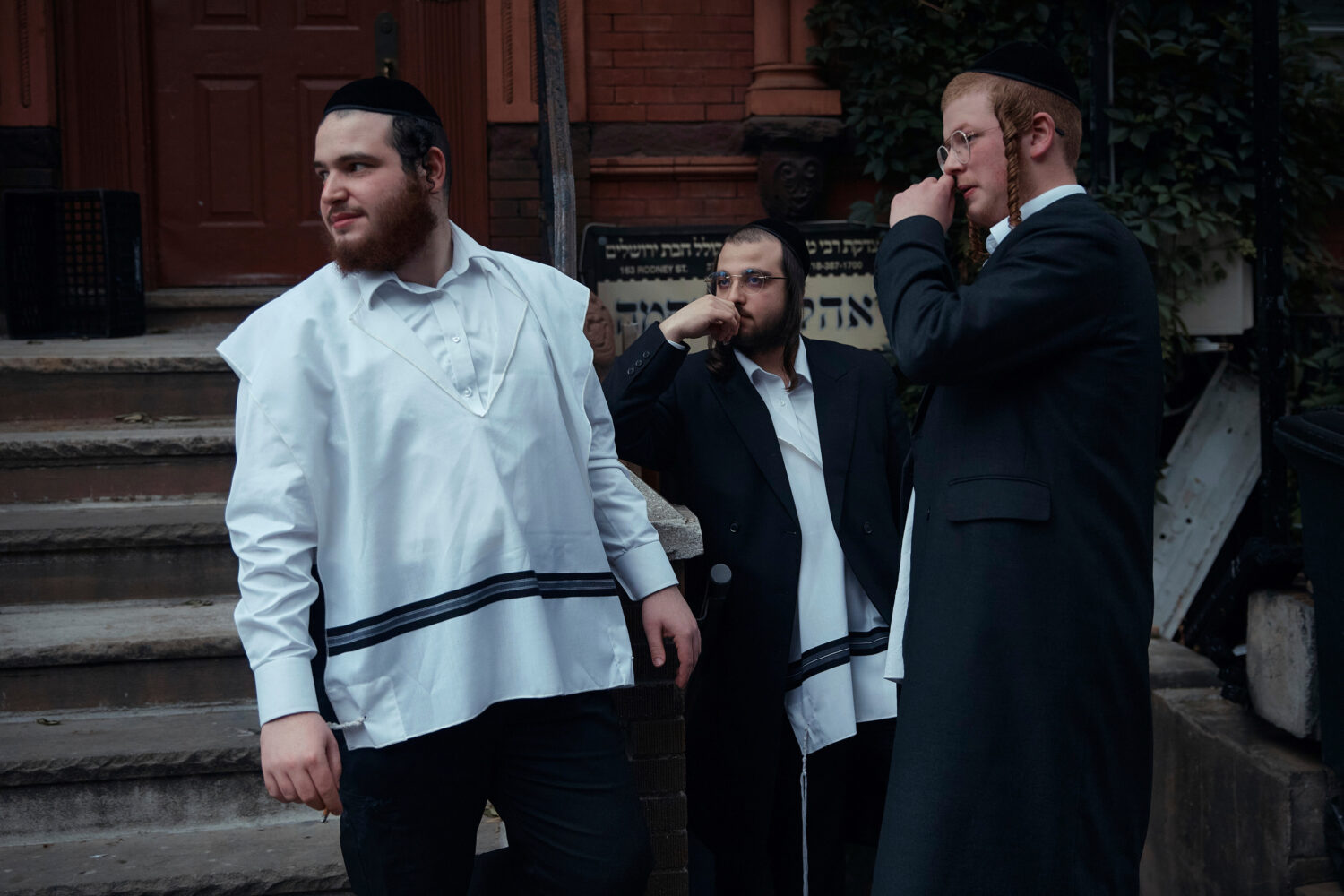 FILE - Hasidic Jewish men chat on June 16, 2025, in the Brooklyn borough of New York. (AP Photo/And...
