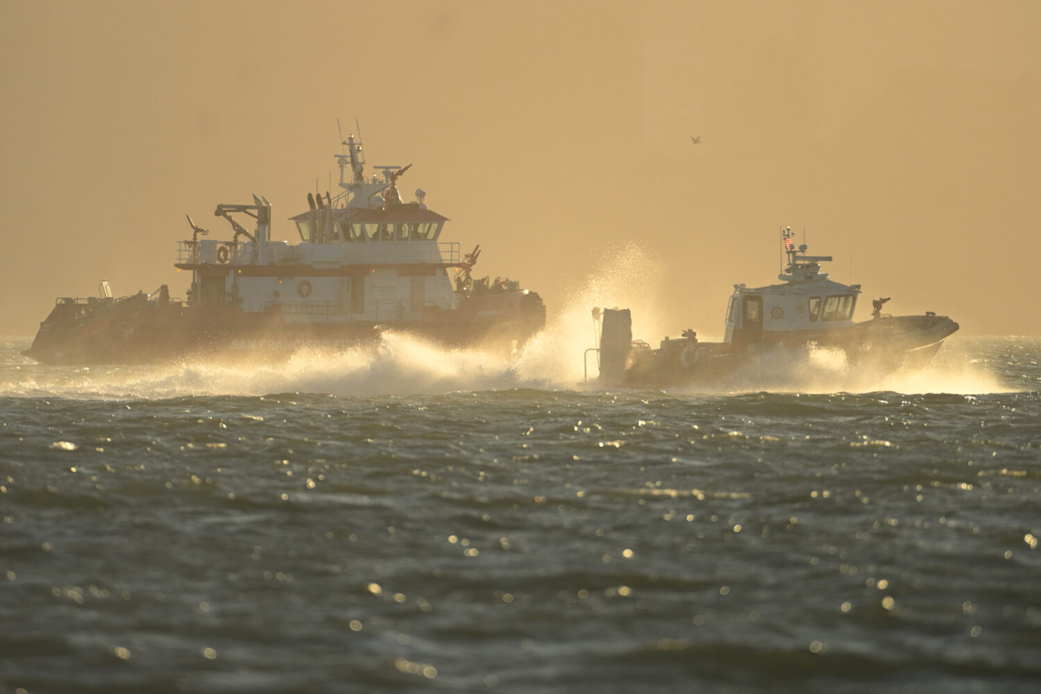 Search and rescue vessels look for missing victims after a boat accident near Alcatraz Island off S...
