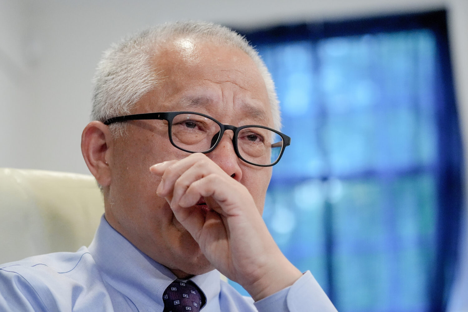 Chinese pastor Ezra Jin Mingri becomes emotional during an interview with The Associated Press in M...