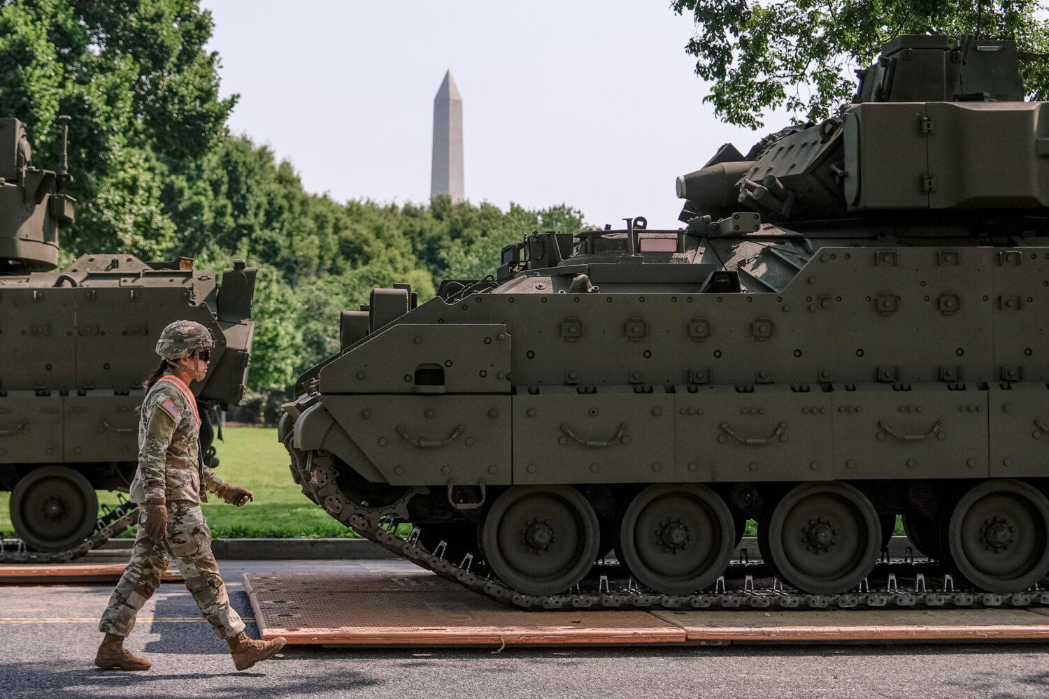FILE - A U.S. Army soldier walks past a Bradley fighting vehicle staged in West Potomac Park ahead ...