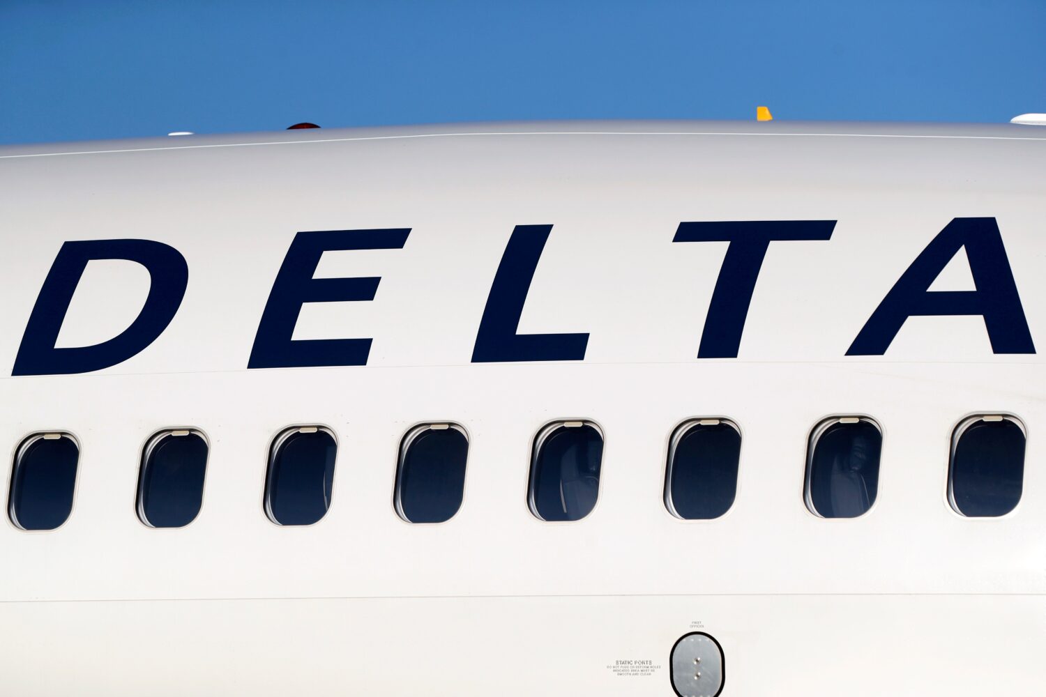FILE - In this June 26, 2019, file photo, the company logo graces the side of a Delta Air Lines jet...