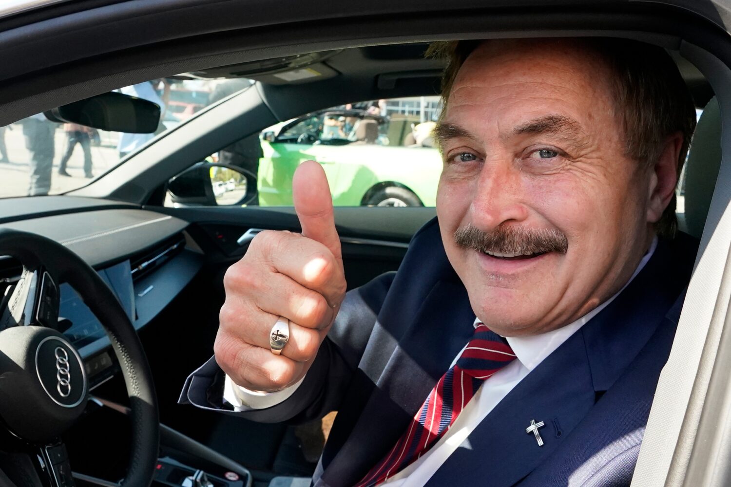 FILE - Mike Lindell gives a thumbs up as he passes by a rally for supporters of former President Do...