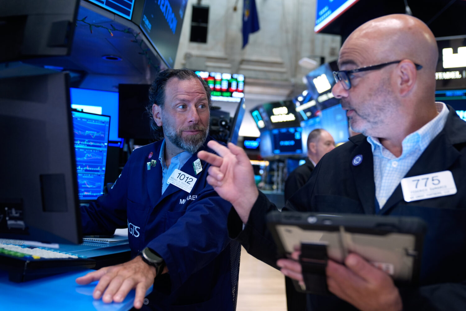 Michael Pistillo, left, and Federico DeMarco work on the floor at the New York Stock Exchange in Ne...