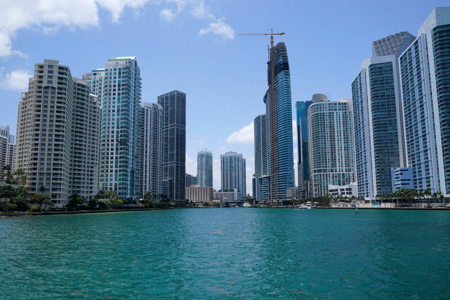 FILE - High-rise buildings at the mouth of the Miami River are seen from Biscayne Bay, May 9, 2022,...