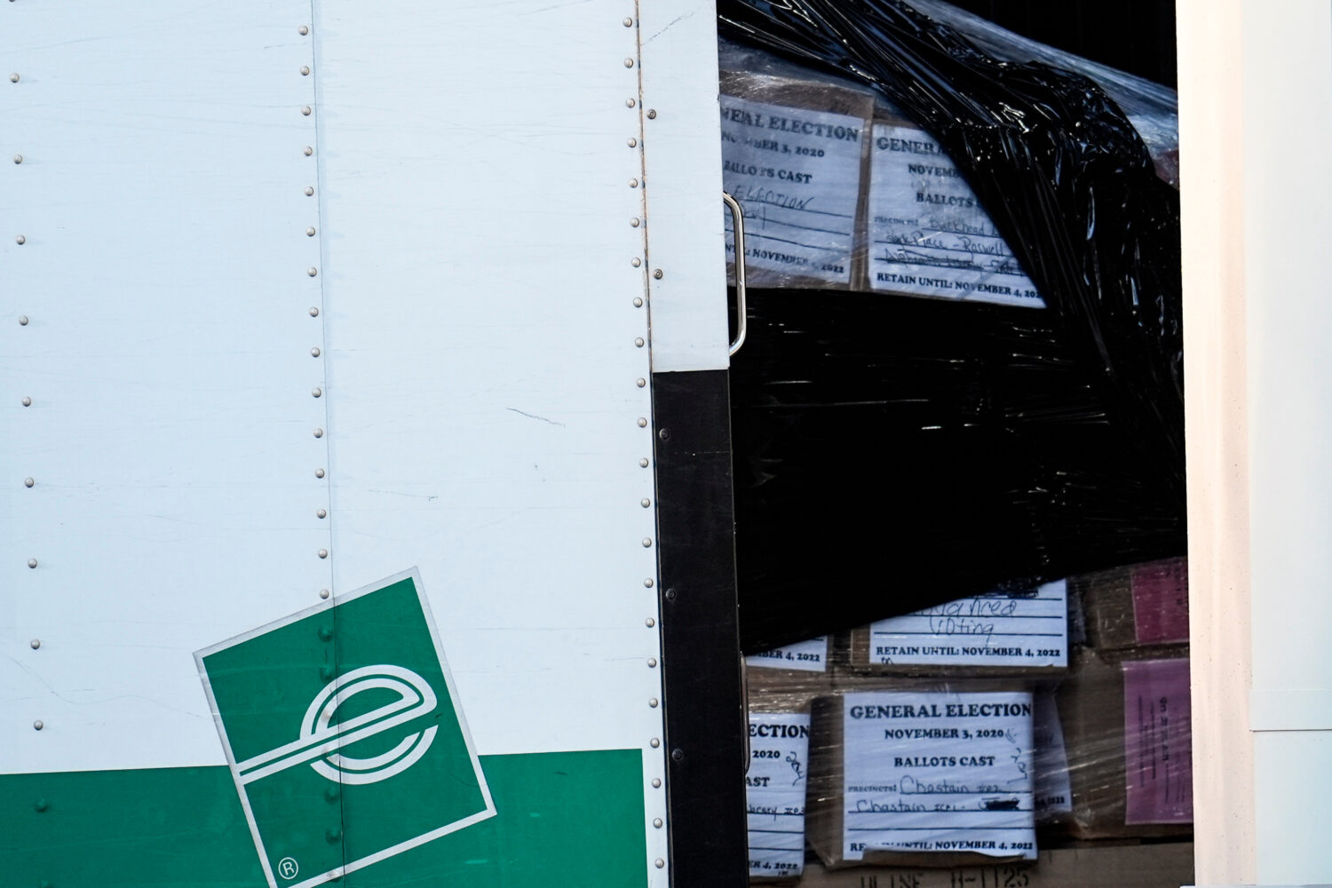 FILE - Georgia general election 2020 ballots are loaded by the FBI onto trucks at the Fulton County...