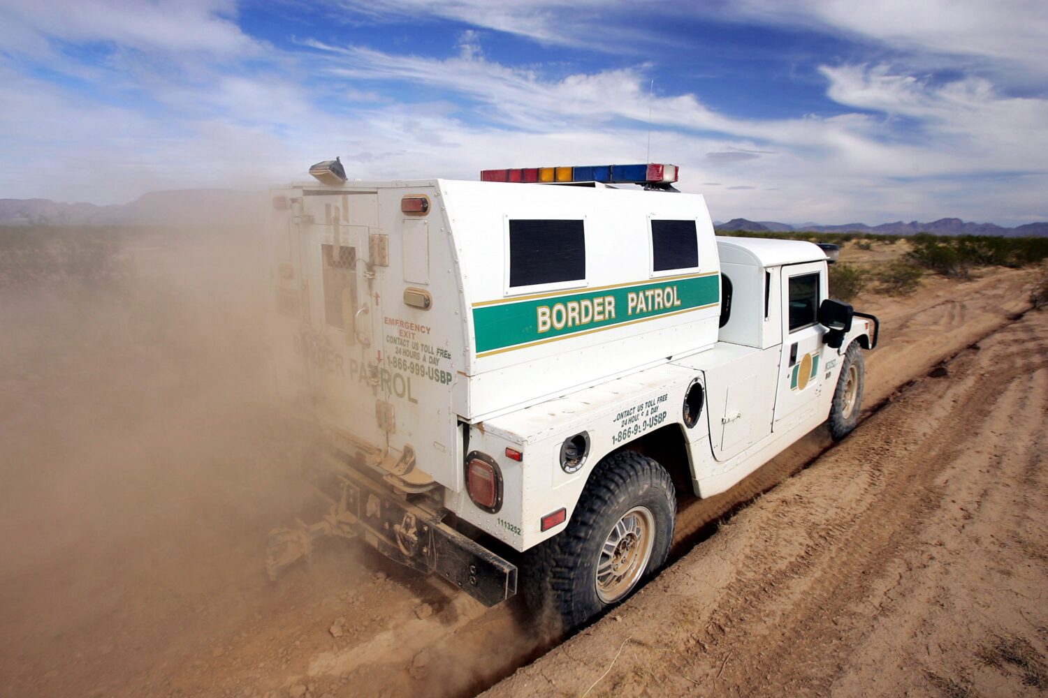 A Border Patrol vehicle drives through the Cabeza Prieta National Wildlife Refuge near Ajo in this ...