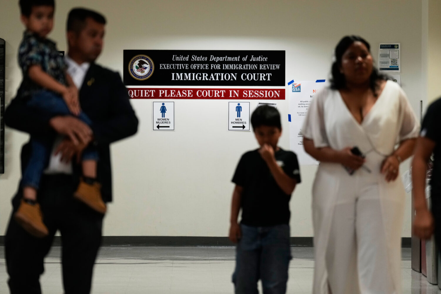 People arrive for immigration court hearings in New York, Monday, July 27, 2026. (AP Photo/Seth Wen...