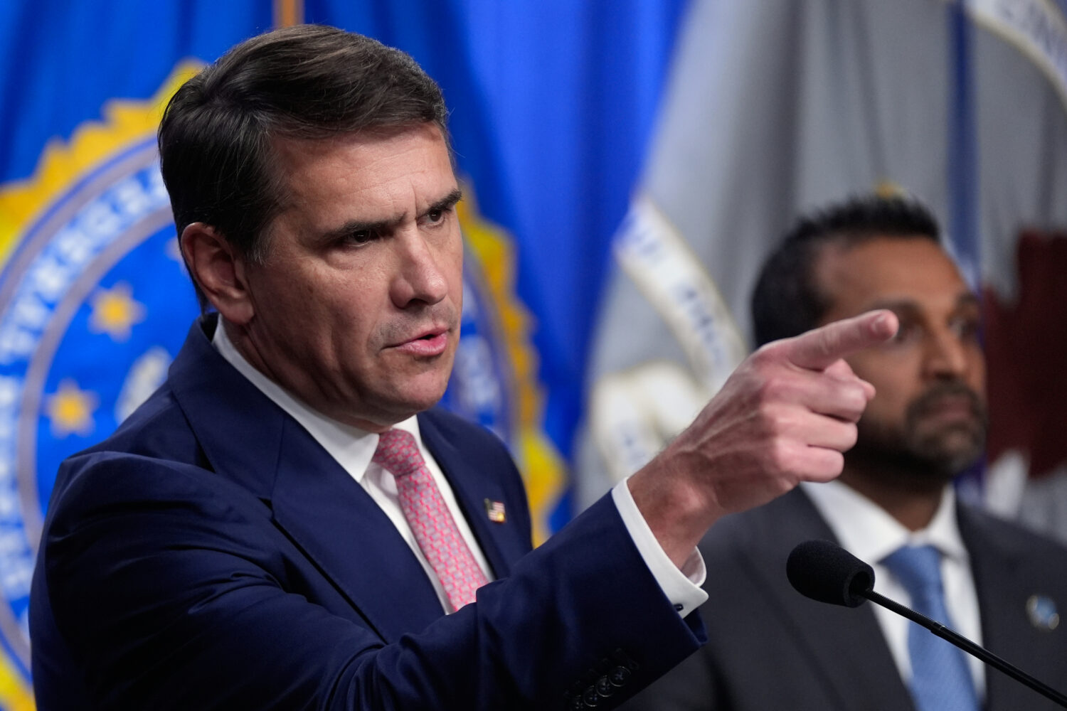 Acting Attorney General Todd Blanche speaks as FBI director Kash Patel speaks during a news confere...