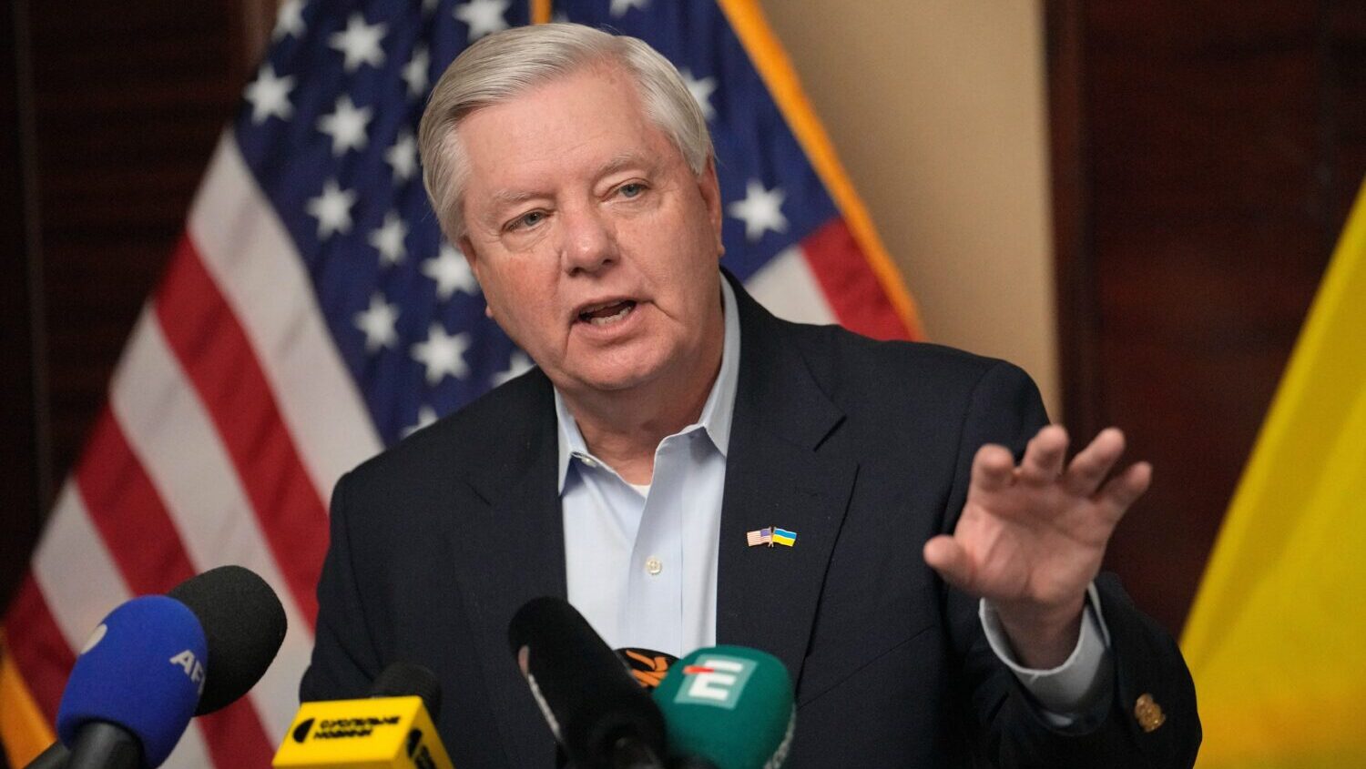 U.S. Sen. Lindsey Graham, R-S.C., gestures as he speaks to the media in Kyiv, Ukraine, March 18, 20...