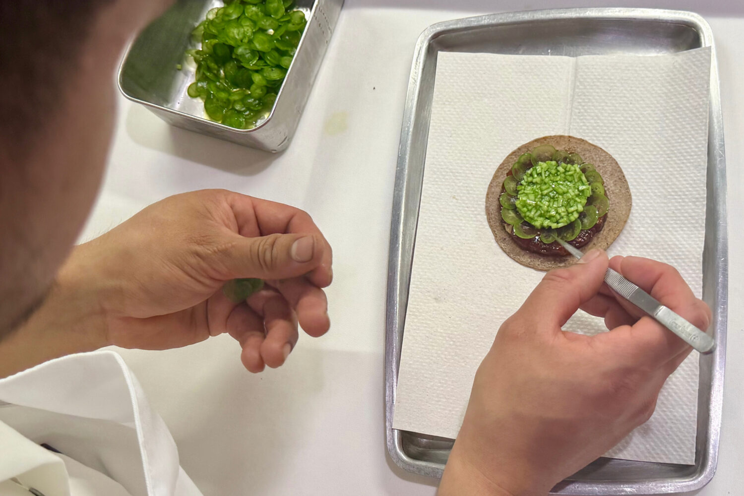 A tostada with bluefin tuna is prepared at Californios in San Francisco on Thursday, July 16, 2026....