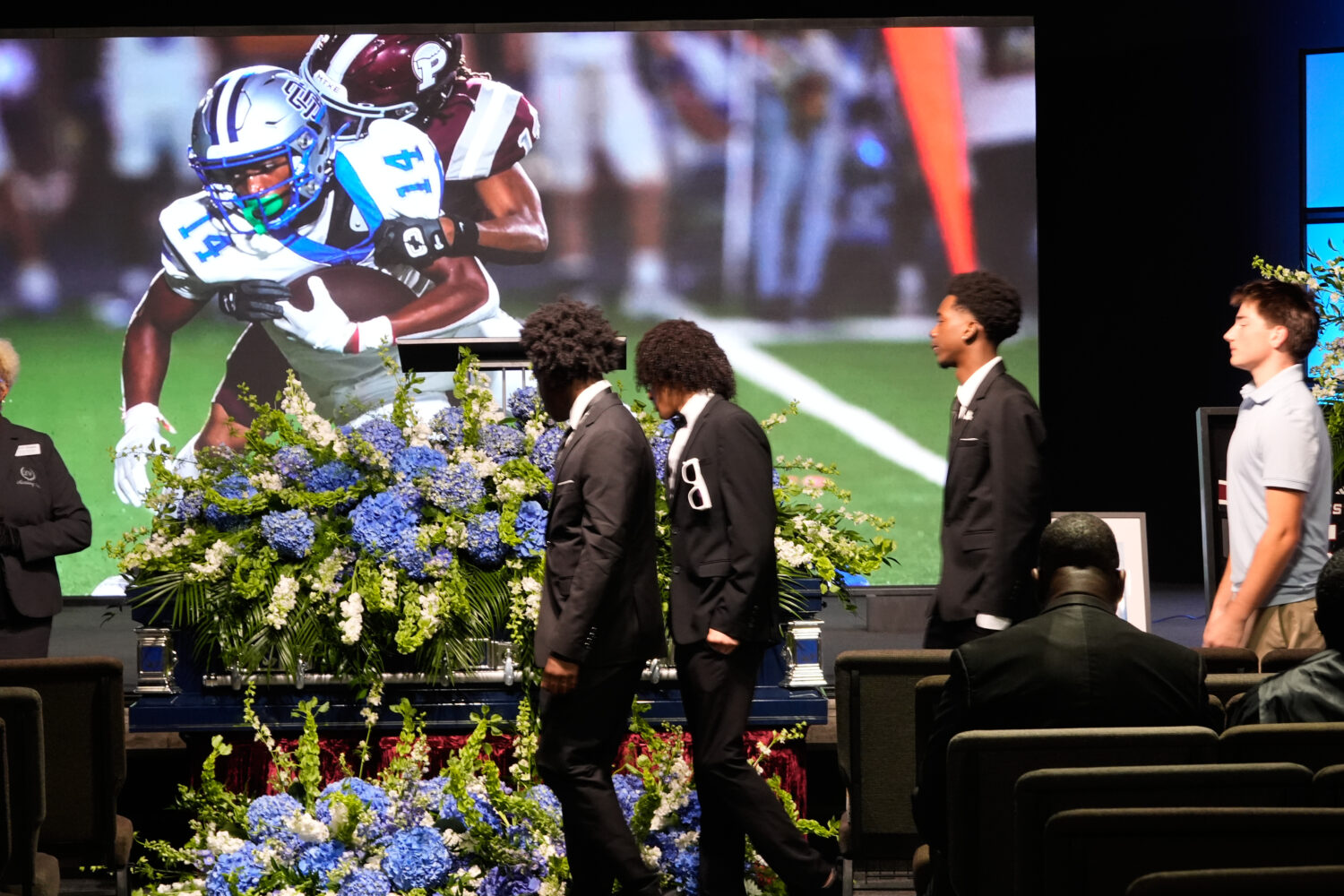 People line up for a viewing during a memorial service for Nolan Xavier Wells, an 18-year-old found...