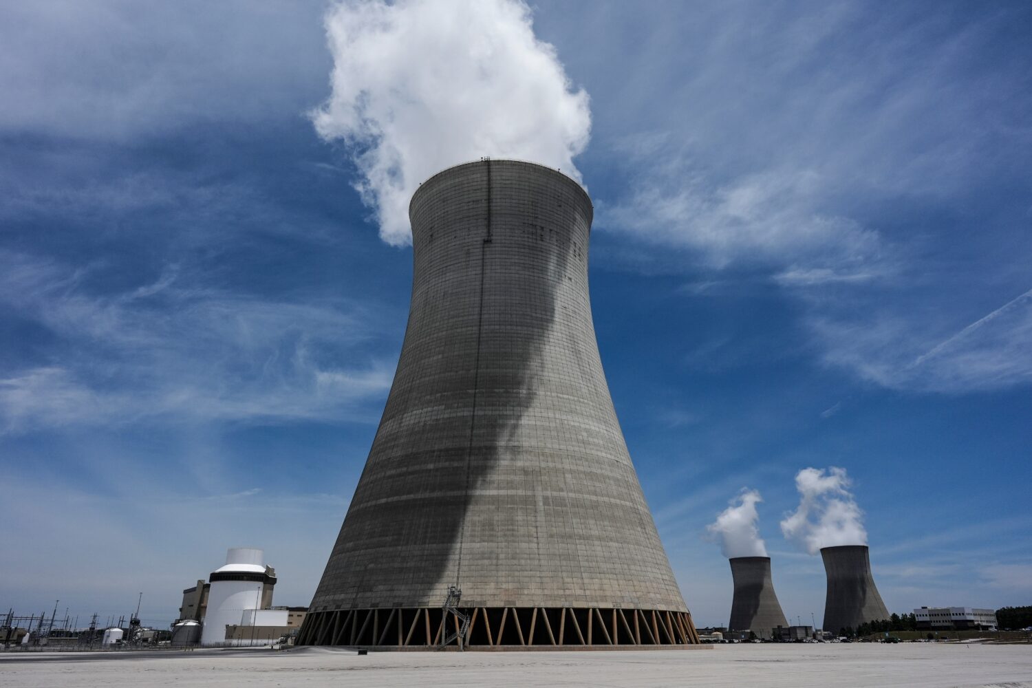 FILE - Cooling tower three with one and two in the background operate at the nuclear reactor facili...