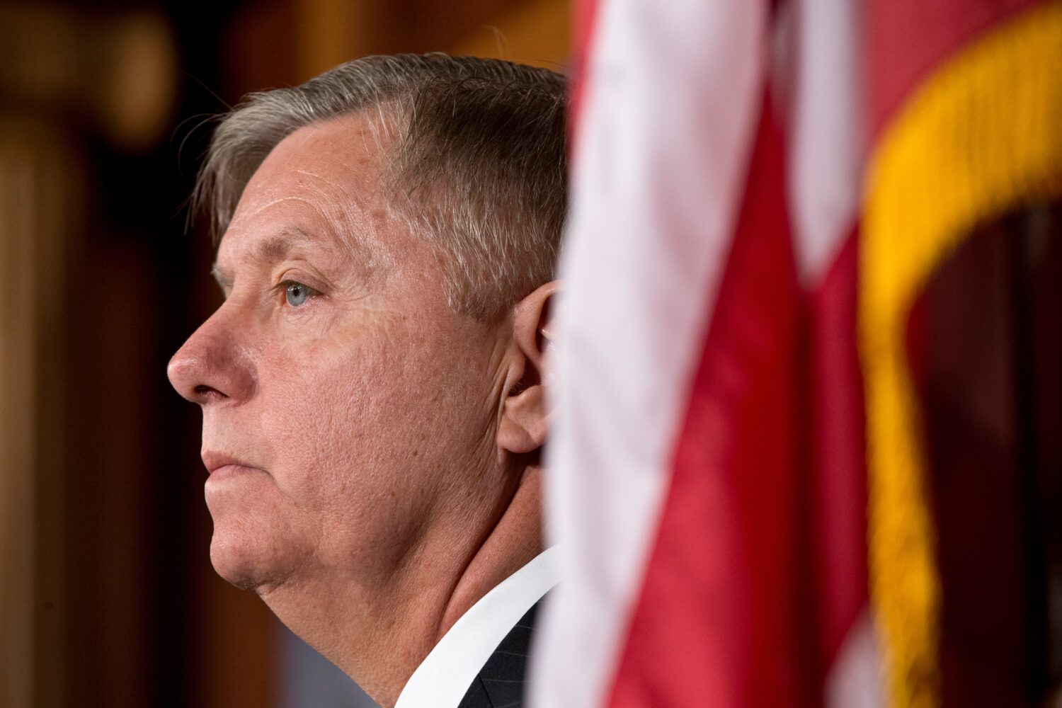 FILE - Sen. Lindsey Graham, R-S.C., listens during a Capitol Hill news conference in Washington, Ma...