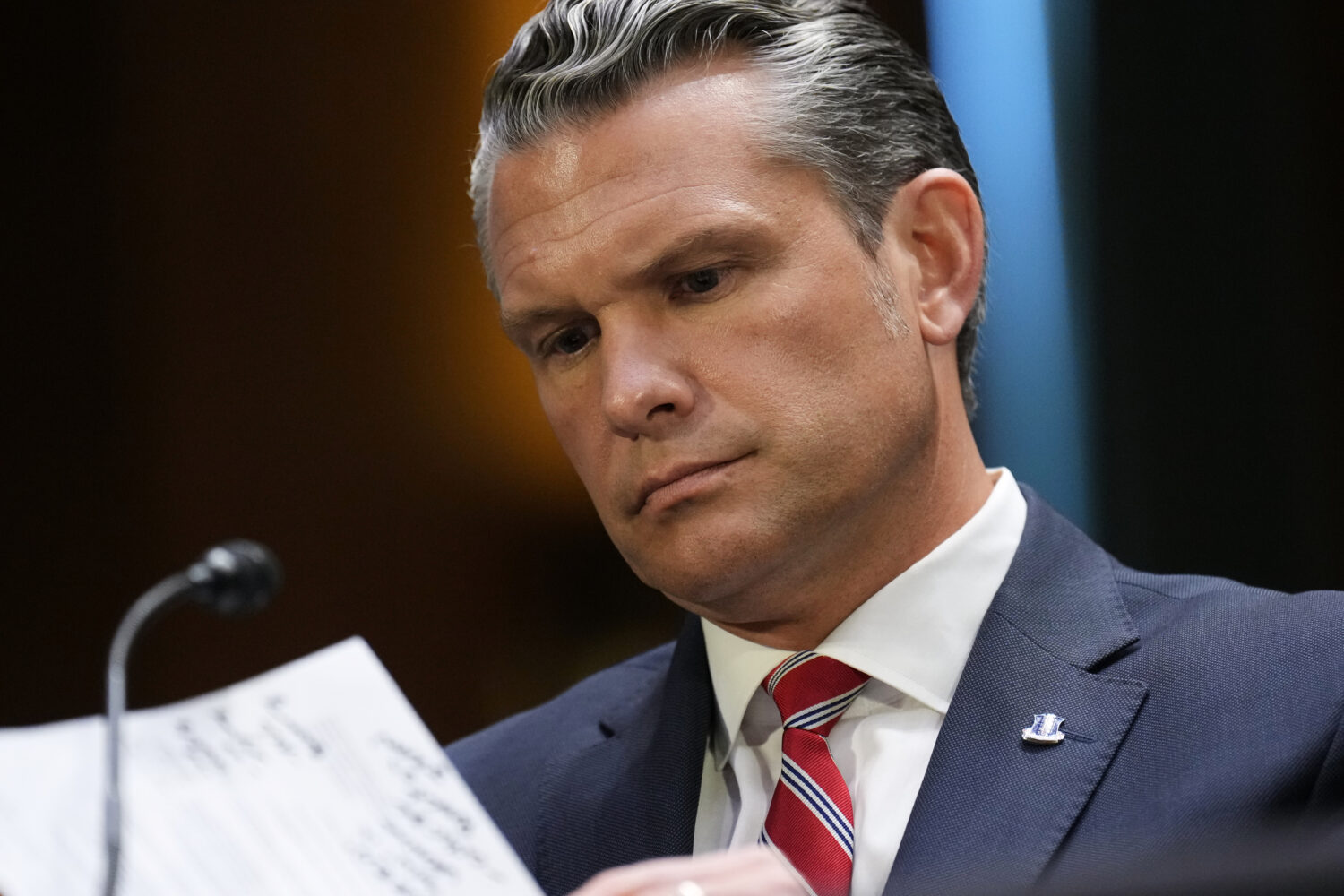 Defense Secretary Pete Hegseth looks at notes as he testifies at a Senate Appropriations Committee ...