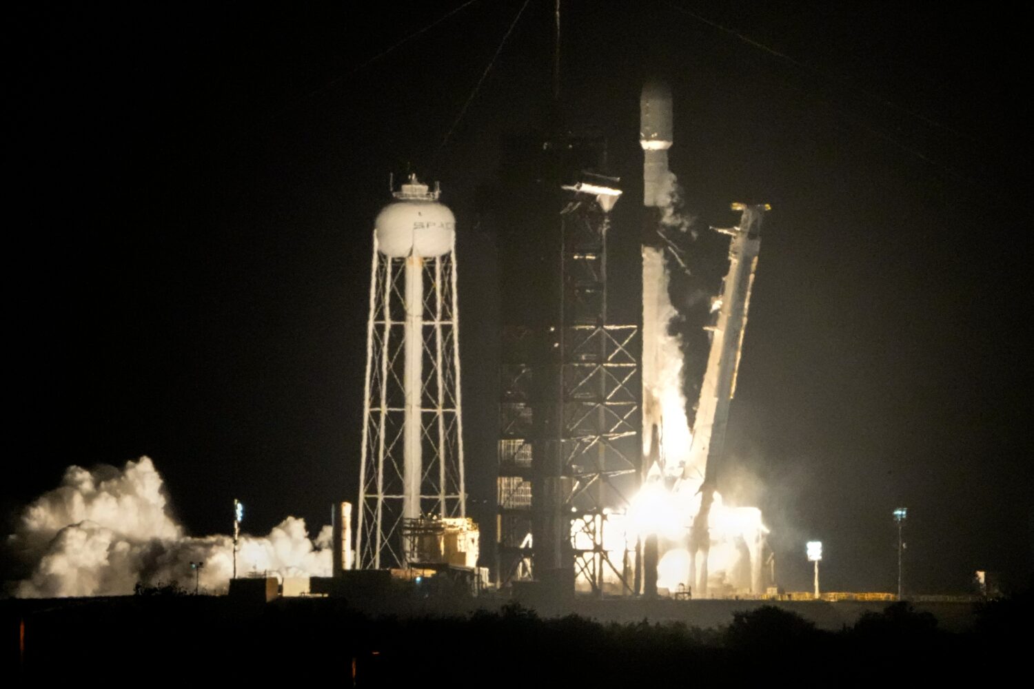 FILE - A SpaceX Falcon 9 rocket lifts off from pad 39A with a payload of a pair of lunar landers at...