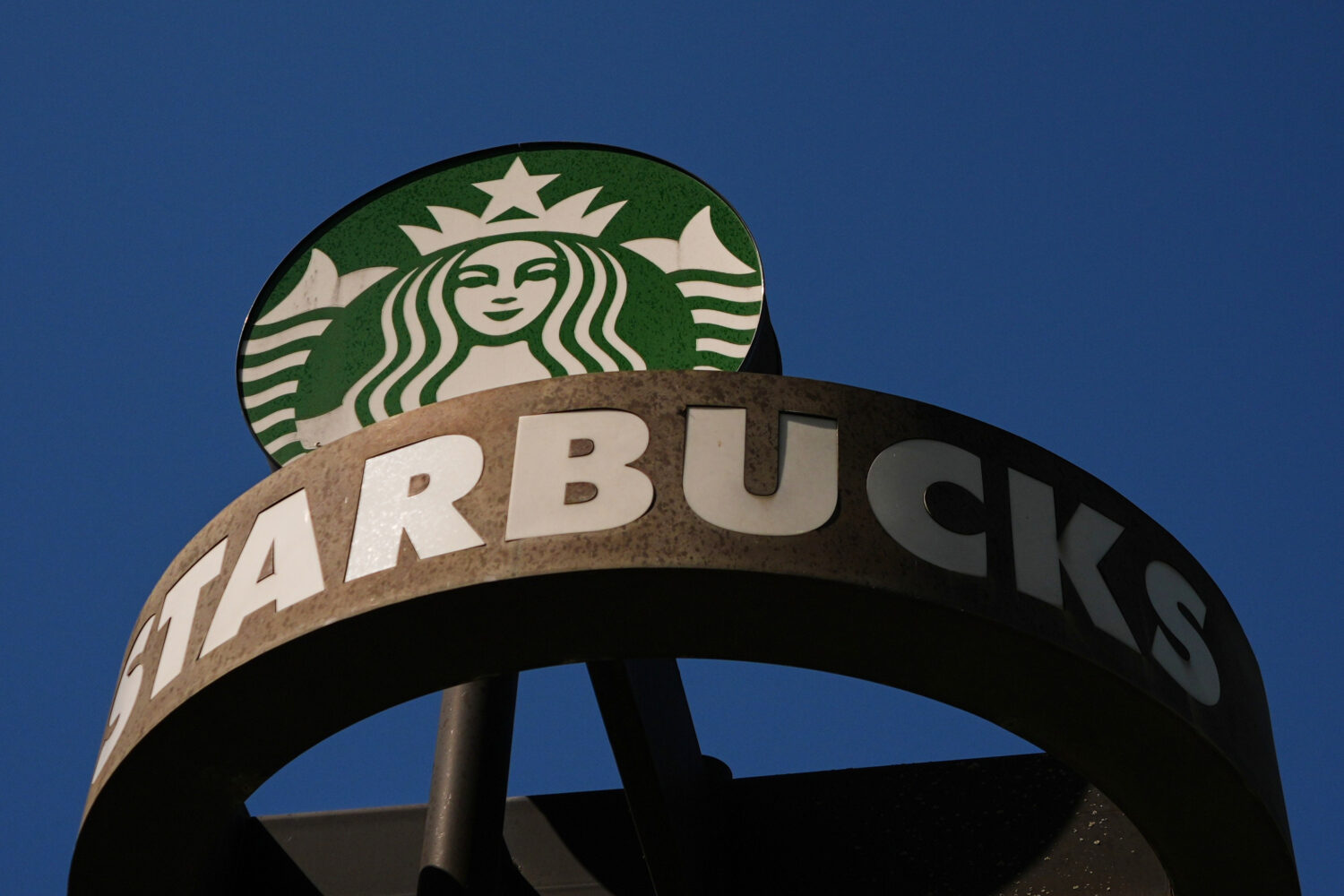 FILE - A Starbucks sign is seen outside the coffee company's global corporate headquarters, May 11,...