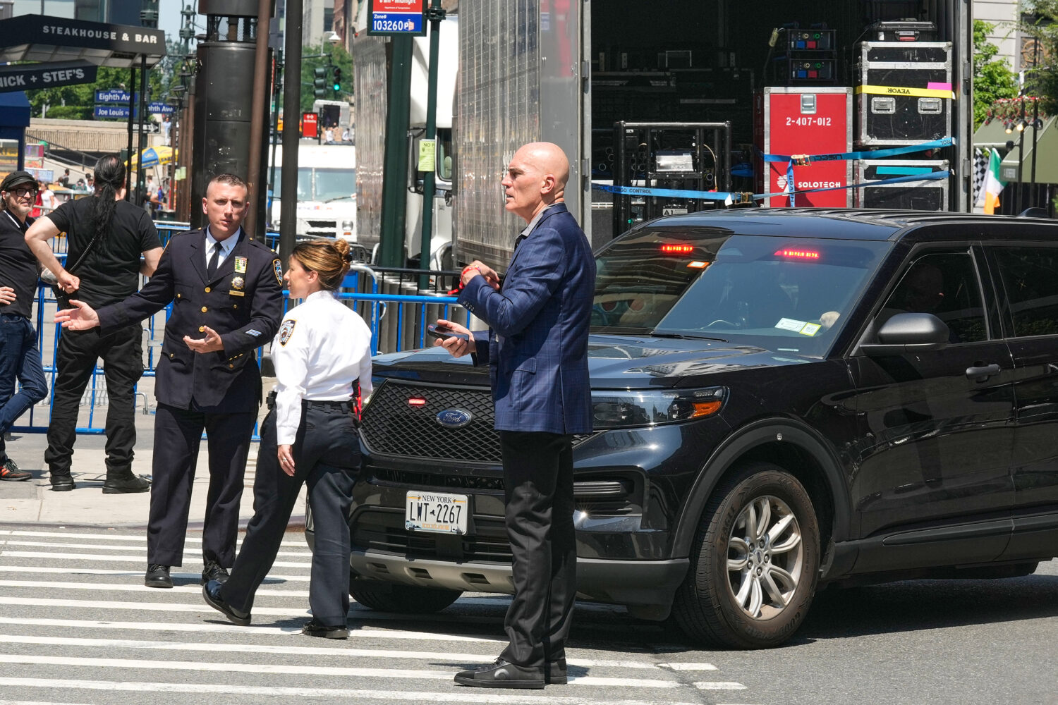 Security personnel meet outside New York's Madison Square Garden, Wednesday, July 1, 2026. (AP Phot...