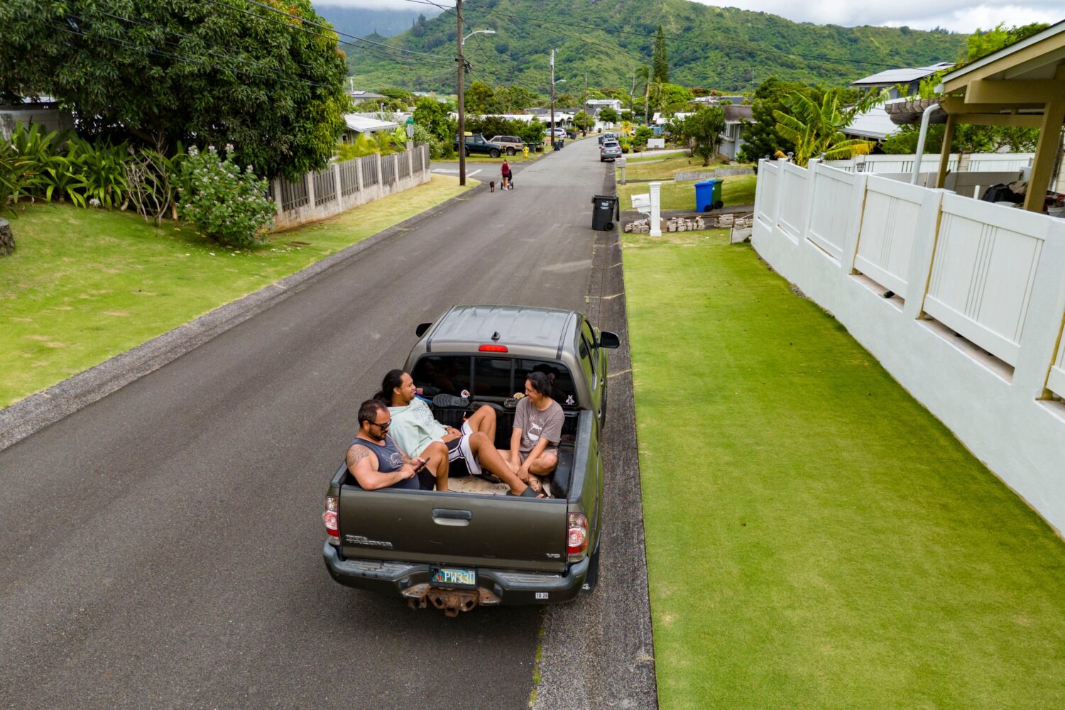 Kimeona Kane rides with his nephew, Gabriel Shimaoka, and niece, Genesis Shimaoka, in the bed of hi...