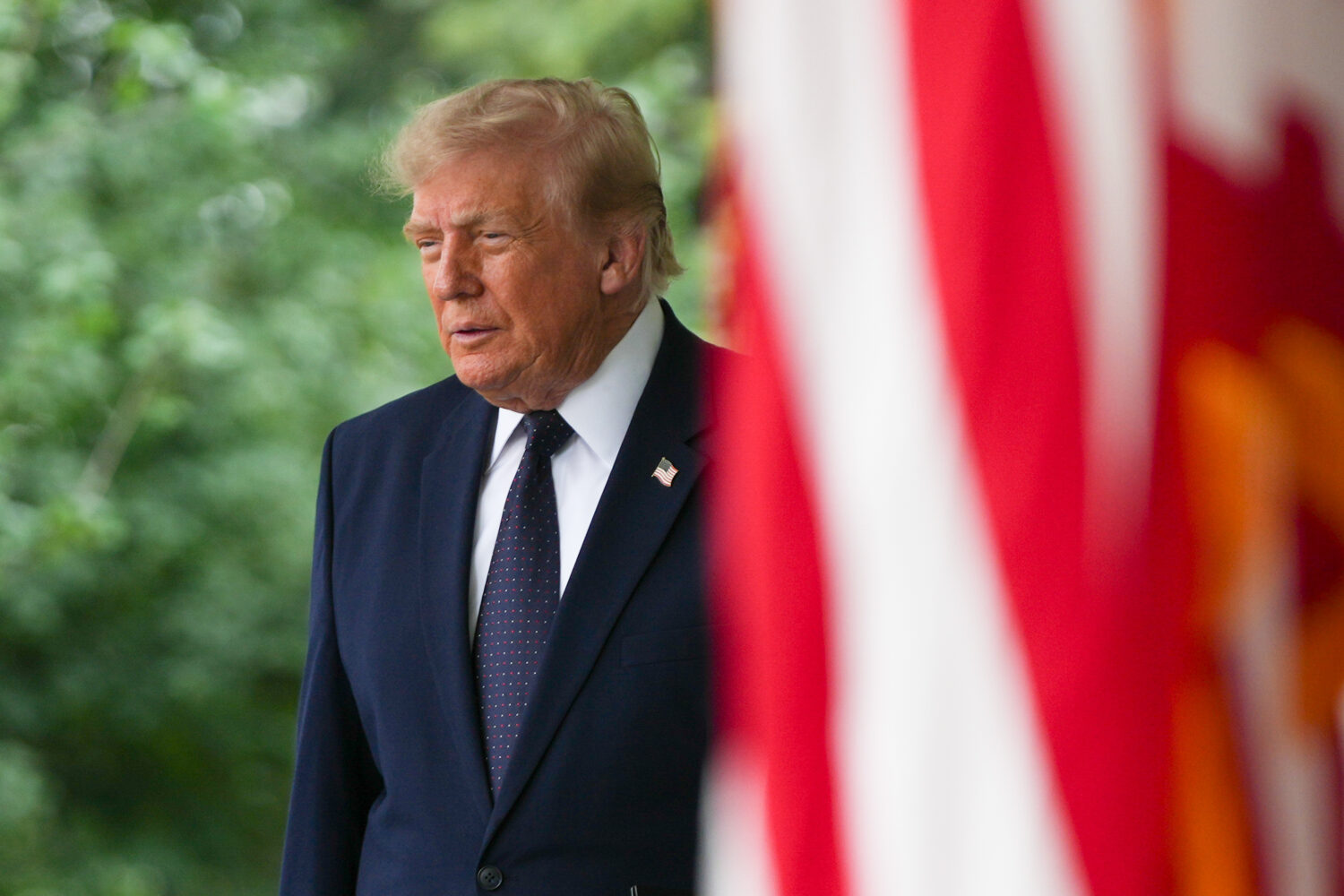 President Donald Trump arrives to speak at a lunch in the White House Rose Garden, Monday, July 6, ...