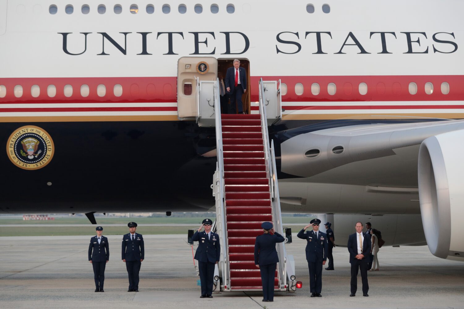President Donald Trump walks down the stairs of Air Force One upon his arrival at Joint Base Andrew...
