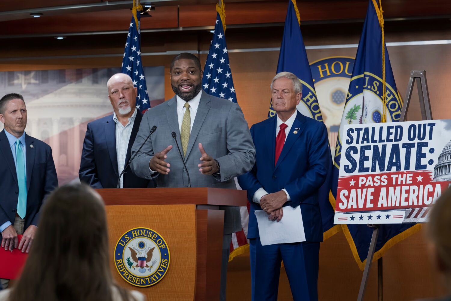 Rep. Byron Donalds, R-Fla., center, flanked by Rep. Chip Roy, R-Texas, left, and Rep. Ralph Norman,...