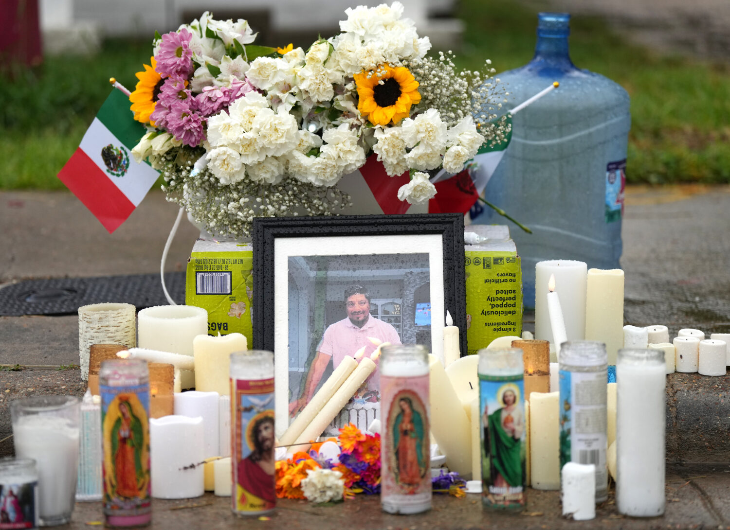 A memorial grows at the site where Lorenzo Salgado Araujo was fatally shot by ICE agents, last week...