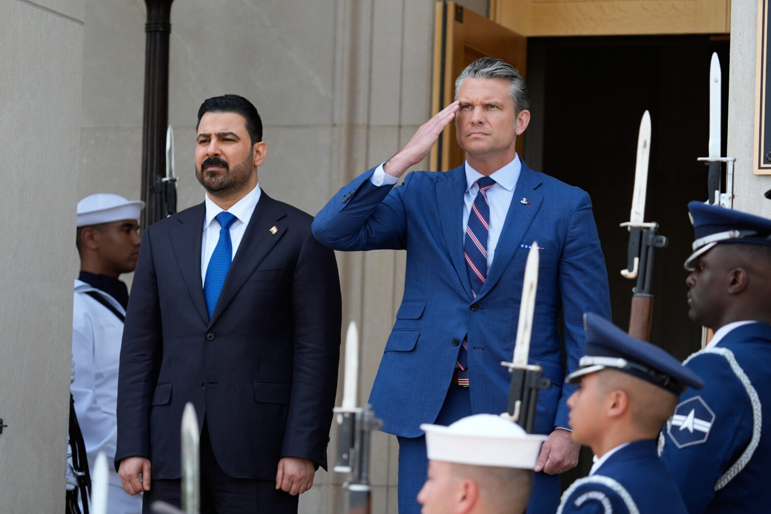 Secretary of Defense Pete Hegseth, right, welcomes Iraqi Prime Minister Ali al-Zaidi, to the Pentag...