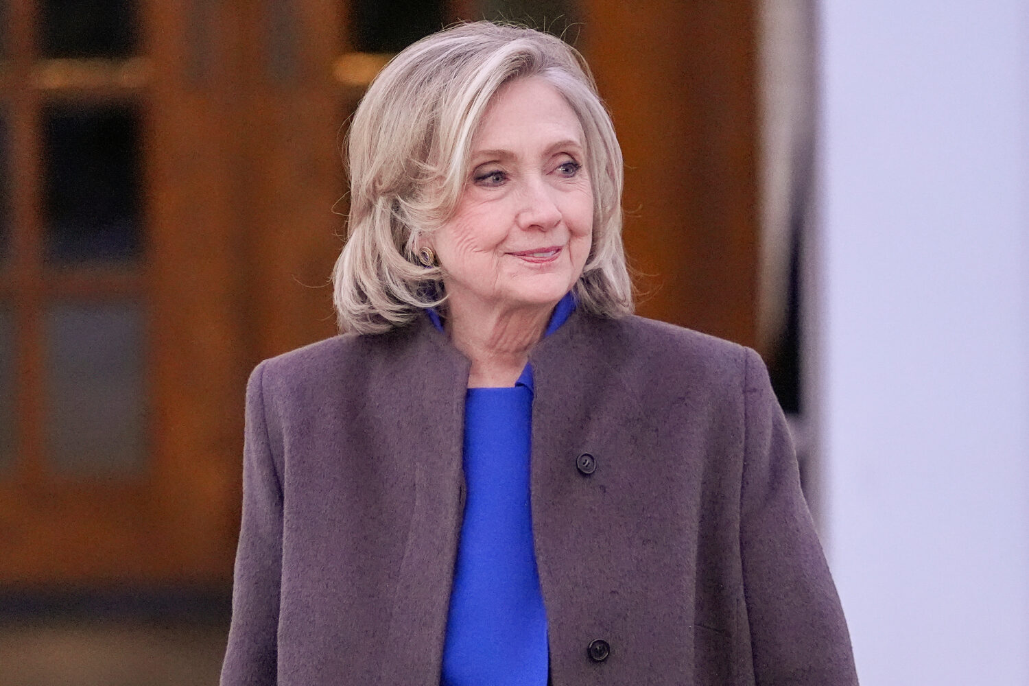 FILE - Former Secretary of State Hillary Clinton walks outside the Chappaqua Performing Arts Center...