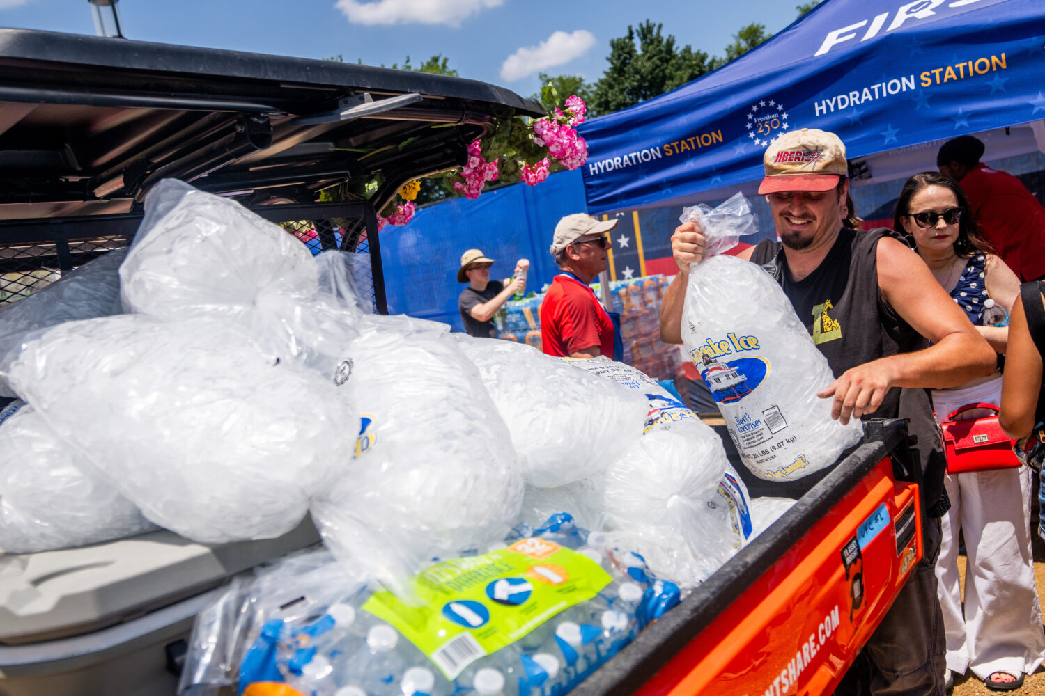 Vendors distribute ice at the Great American State Fair on the National Mall, Friday, July 3, 2026,...