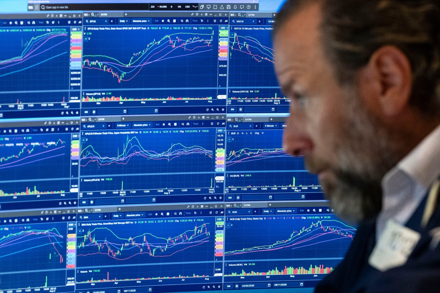 Specialist Michael Pistillo works on the floor of the New York Stock Exchange, Wednesday, Aug.. 5, ...