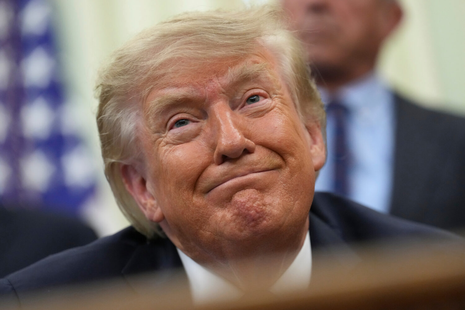 President Donald Trump smiles during an event about drug prices, in the Oval Office of the White Ho...