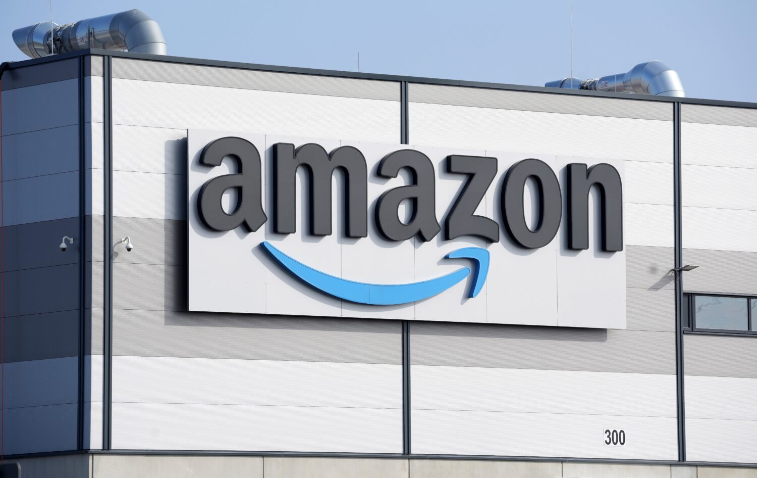FILE - An Amazon company logo marks the facade of a building, March 18, 2022, in Schoenefeld near B...