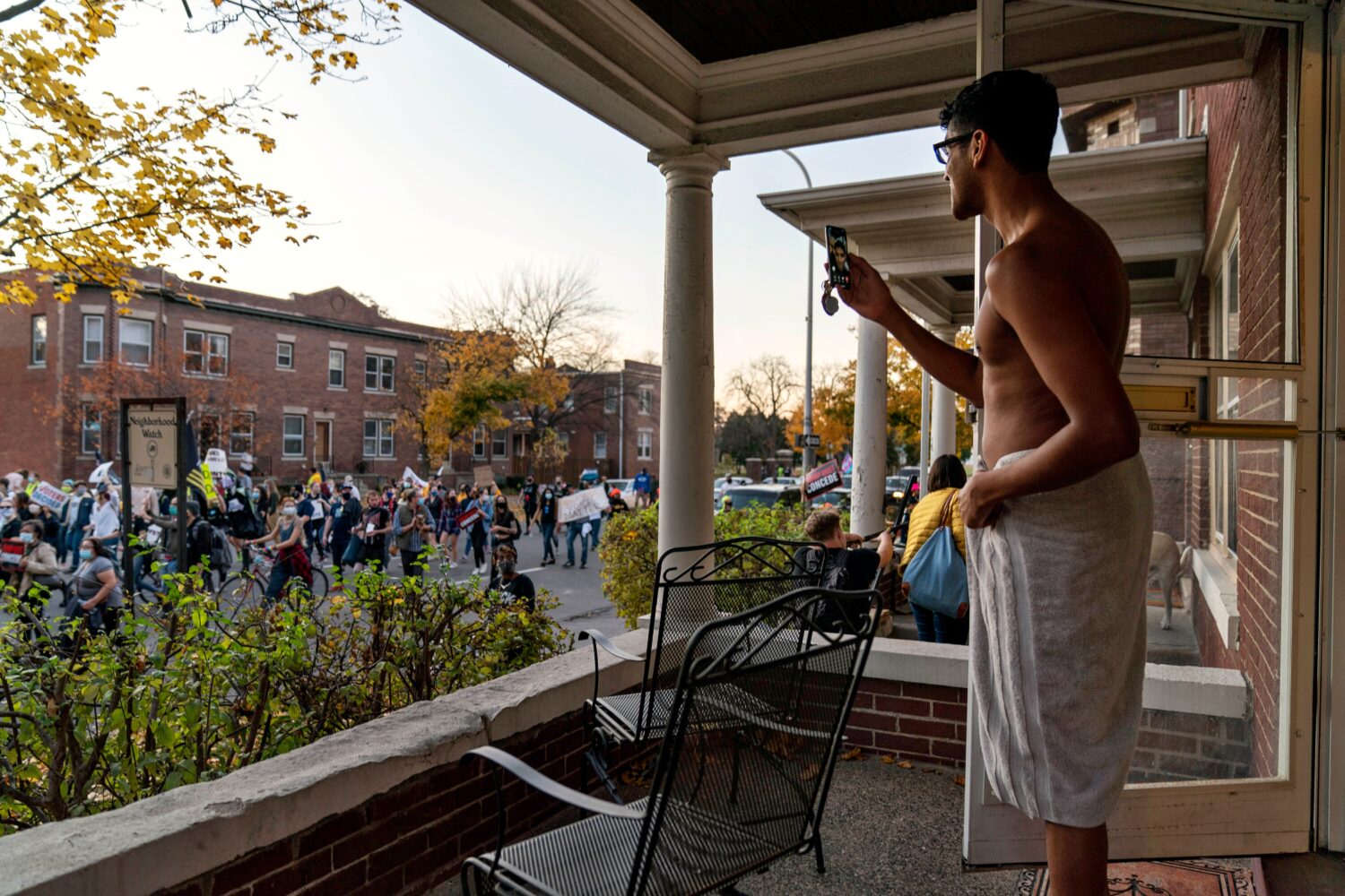 FILE - Karthik Mantha stands on his front porch wearing a towel, just as he was about to step into ...