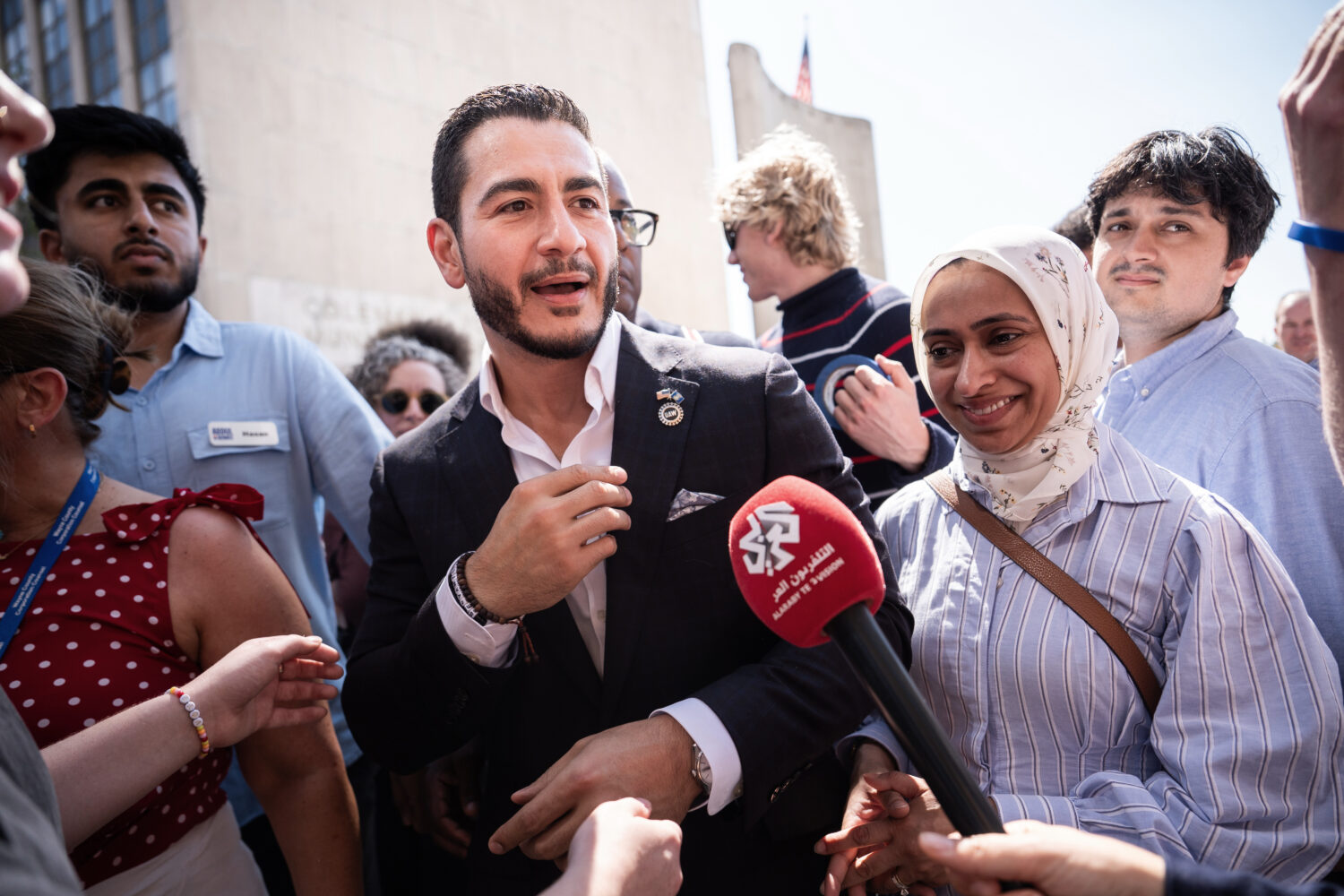 Abdul El-Sayed departs following a news conference at the Spirit of Detroit shortly after winning t...