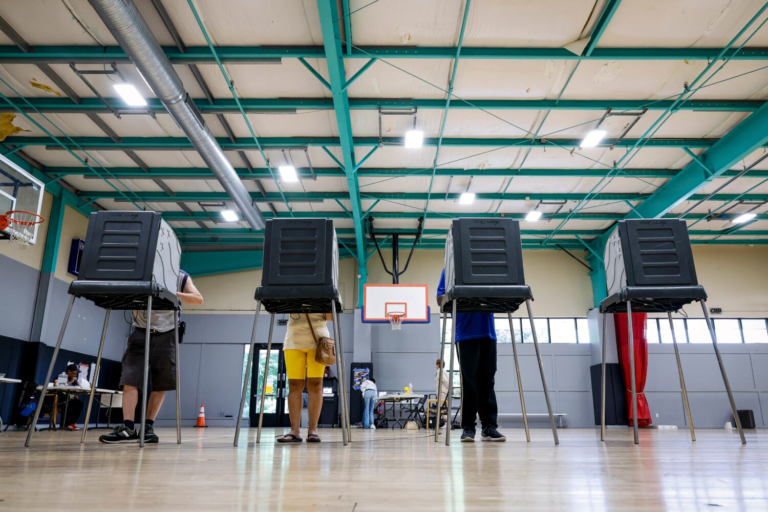 FILE - Voters cast their ballots during the primary election in Windsor, Conn., Aug. 11, 2026. (AP ...