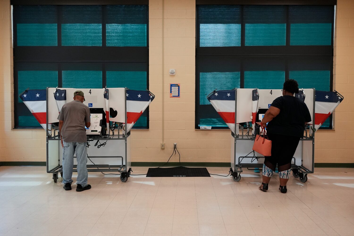 People vote at a polling place in a primary election Thursday, Aug. 6, 2026, in Memphis, Tenn. (AP ...